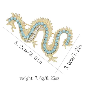 Detailed size map of golden dragon brooch with rhinestones showing dimensions and weight