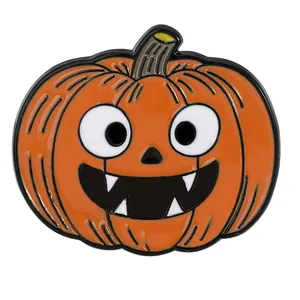 Halloween pumpkin enamel brooch featuring orange jack-o-lantern design with fangs