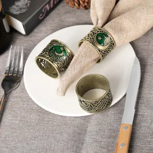 Vintage bronze napkin rings set with green enamel moon and star for Ramadan table decor