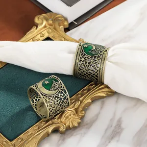 Vintage gold alloy round napkin rings with green enamel moon and star for Eid festivals