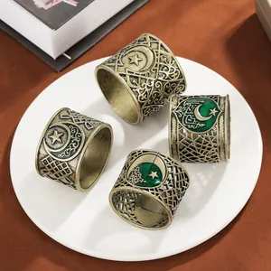 Set of 4 vintage gold alloy napkin rings with green enamel moon and star for Eid