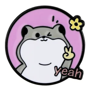 Cute cartoon hamster enamel pin with yellow flower and yeah sign on purple background