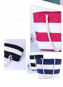Close-up of durable striped canvas tote bag with thick rope handles and metal eyelets
