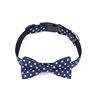 Adjustable navy blue cotton dog collar with white star patterns and a classic bow tie