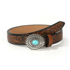 Vintage western brown leather belt with embossed floral pattern and turquoise metal buckle