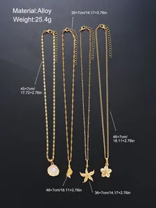 Detailed size specifications for gold starfish shell and pearl necklace set on black backdrop