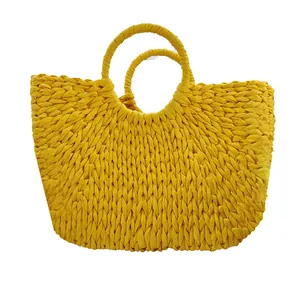 Handmade yellow crescent straw handbag with woven texture for summer beach vacation