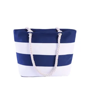 Large nautical canvas tote bag with blue stripes and thick hemp rope handles for shopping
