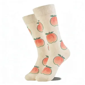 Detail of crew socks with pink peach pattern and ribbed cuffs on white background