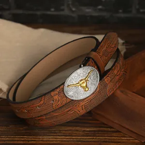 Detailed close-up of brown PU leather belt with bull head embossing and silver buckle