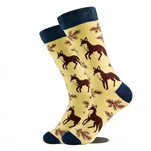 Close-up of crew socks featuring fox and pine needle patterns with contrast heels