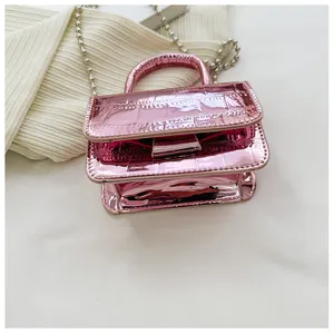Close-up of pink laser metallic mini bag with crocodile texture and silver ball chain