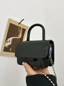 Girls glossy crocodile pattern mini crossbody bag with silver chain strap in black