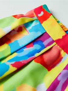 Detail of artistic watercolor abstract print fabric and elastic waistband on wide leg pants