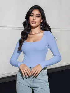 Detail of light blue ribbed knit fabric on a slim-fit square neck long sleeve top