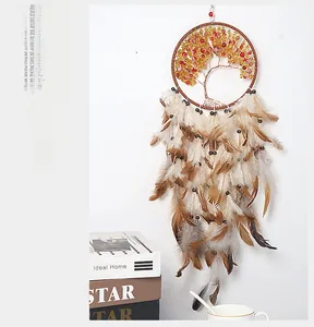 Detail of life tree dream catcher with yellow beads and layered brown feathers