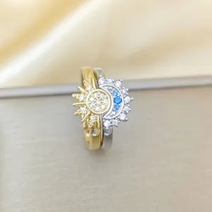 Gold sun and silver moon stacking rings set with blue and white crystals