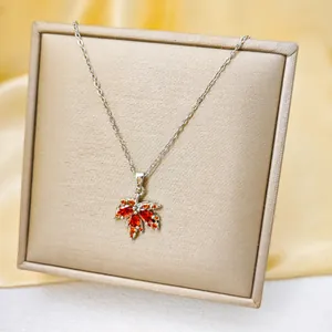 Titanium steel maple leaf necklace featuring sparkling red and orange crystals