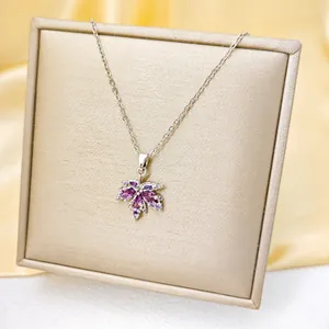 Elegant silver maple leaf necklace with purple and white cubic zirconia stones