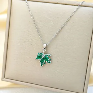 Elegant titanium steel necklace with a green crystal maple leaf pendant for women