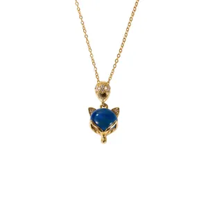 Golden fox pendant necklace with a blue gemstone and sparkling white zircon stones