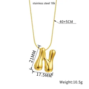 Detail view of 18k gold plated bubble letter N pendant with size and weight specs