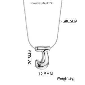 Macro view of 18K stainless steel bubble letter J necklace with size and weight details