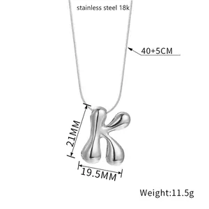 Detail view of 3D bubble letter K pendant with precise 21mm by 19.5mm size dimensions