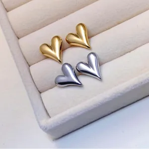 Polished heart stud earrings set in gold and silver finish titanium steel for women