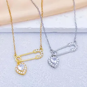 Détails de colliers cœur dorés et argentés avec pendentifs épingle pavés de zircons