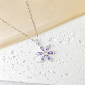 Snowflake pendant necklace in 18K gold plated copper with purple cubic zirconia stones