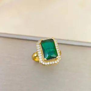 Retro emerald cut green gemstone ring with sparkling zircon halo in gold plating