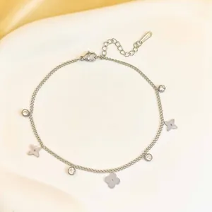 Silver stainless steel clover bracelet with sparkling cubic zirconia charms for women