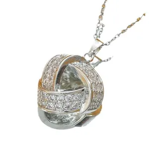 Elegant silver knot necklace pendant with sparkling zircon stones in a minimalist design
