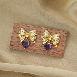 Titanium steel bow heart necklace with gold plating and sparkling purple zircon pendant