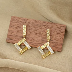 Titanium steel geometric earrings with hammered gold texture and pavé zircon stones
