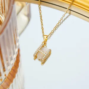Elegant gold titanium steel necklace featuring an H-shaped opal pendant and zircon inlay