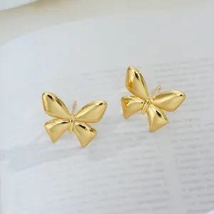 Boucles d'oreilles papillon en acier titane doré poli pour femmes au style minimaliste