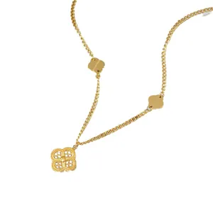 Golden titanium steel clover necklace with solid and hollow charms on a flat chain