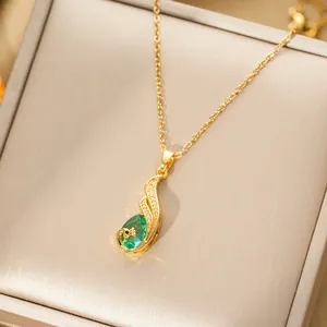 Elegant gold-tone peacock necklace with green pear-shaped gem in a luxury gift box