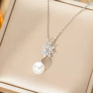 Elegant titanium steel necklace with pearl flower pendant and zircon tassel details