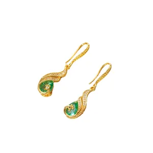 Elegant gold peacock earrings with emerald green teardrop stones and zircon accents