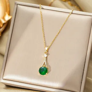 Luxurious gold necklace with emerald green zircon pendant and micro-pave diamond accents
