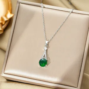 Sparkling titanium steel necklace with emerald green pendant in a champagne gift box