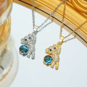 Collar de oso planeta cielo estrellado en oro y plata con piedras de circonita brillante
