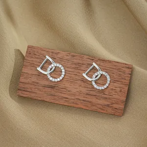 Modern interlocking geometric titanium steel earrings with cubic zirconia inlay