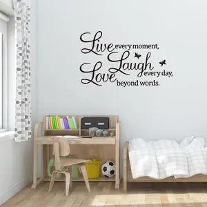 Detail of creative 'Love' wall sticker with butterflies for cozy bedroom decor
