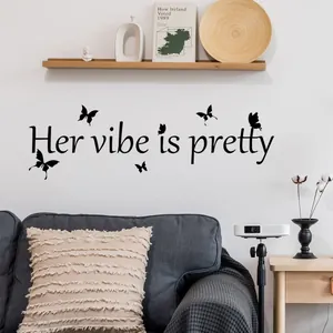 Sticker mural Her vibe is pretty avec papillons noirs pour décoration salon moderne