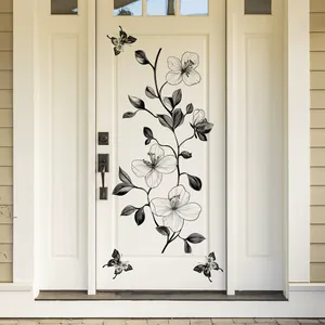 Minimalist black line flower and butterfly wall stickers on a white door and beige wall