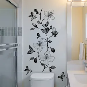 Detailed wall sticker view of black floral vines and butterflies in a modern bathroom
